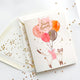 The First Snow - Happy Birthday Balloon Cat with Gold Confetti Card