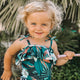 Little girl with magic teething wand in rose
